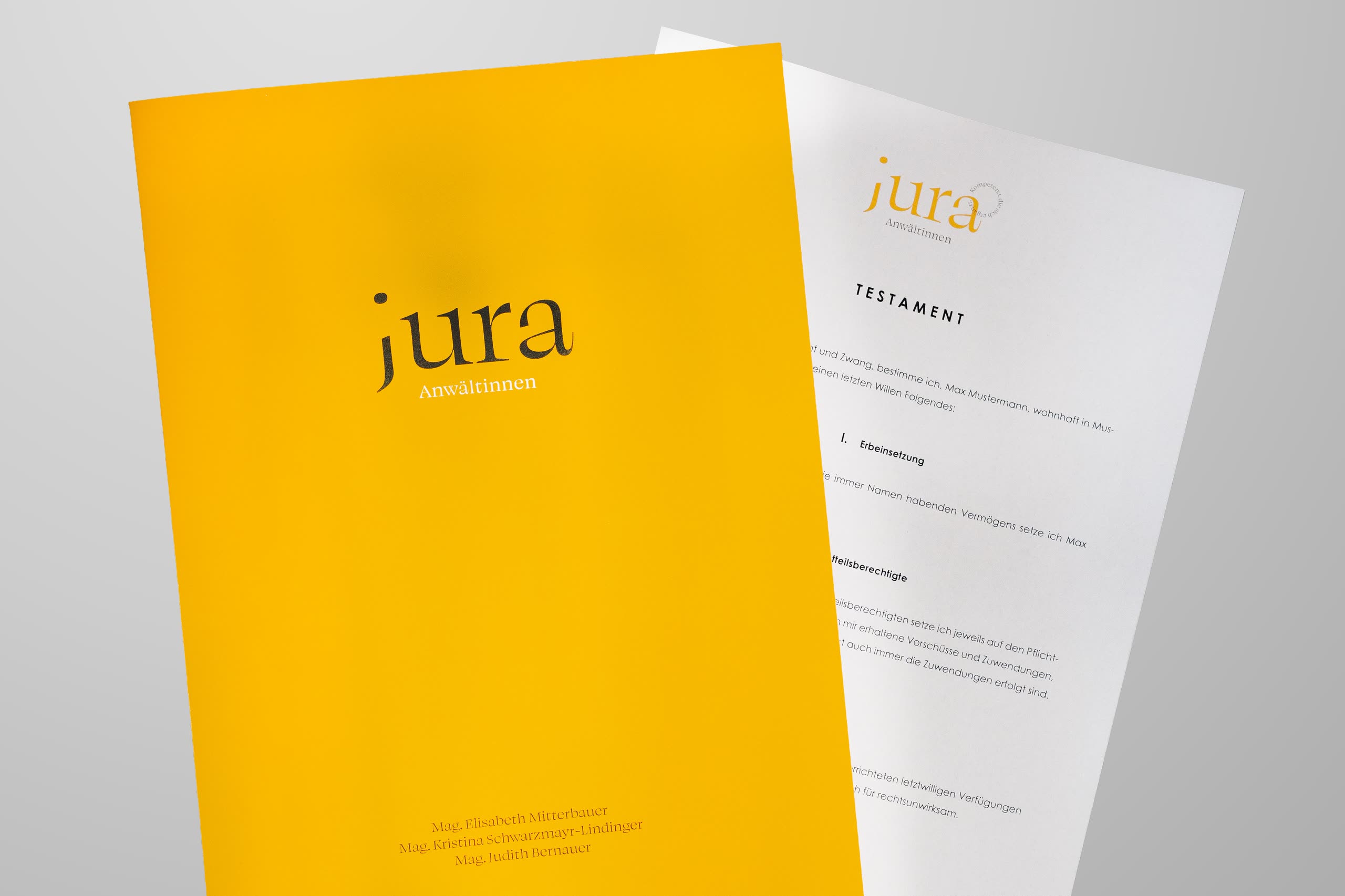 Testament und gelbe Mappe mit Jura Logo